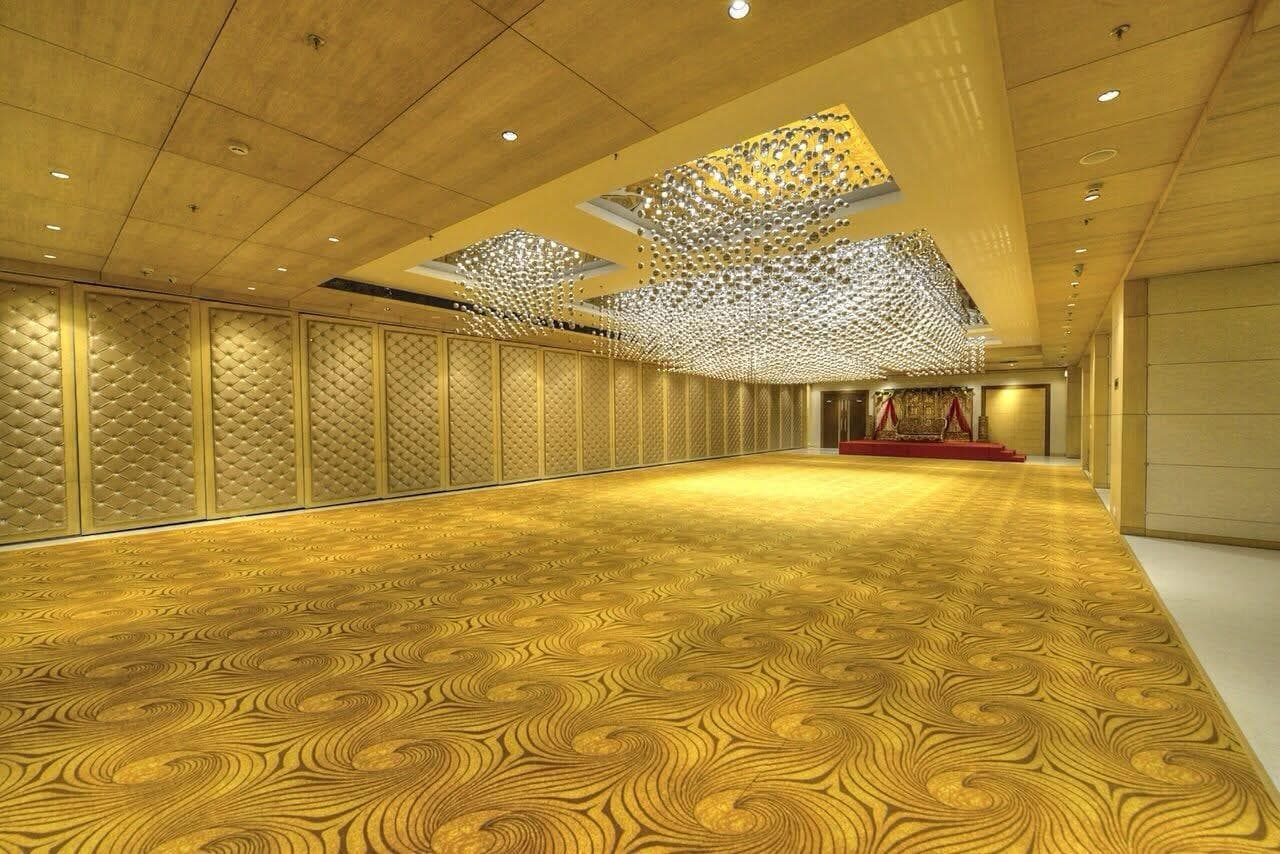 Grand Ball Room with a suspended crystal ceiling installation and stage backdrop